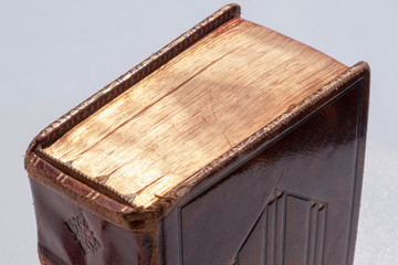 Gilt edges of old book covered with a thin layer of gold leaf