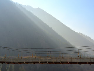 Fototapeta premium Rope bridge in the mountains