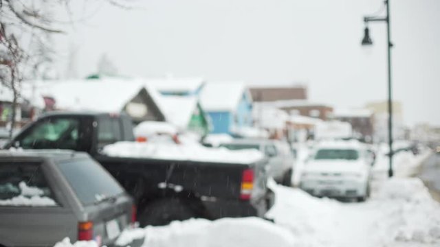 Snow covered cars in a suburban parking lot for background plate