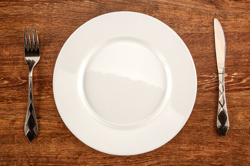 kitchenware  utensils in the form of a white plate, fork and knife