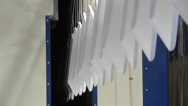 Automatic powder coating line. Powder coating of metal parts. Powder coating of metal parts with thermal polymerization paint.