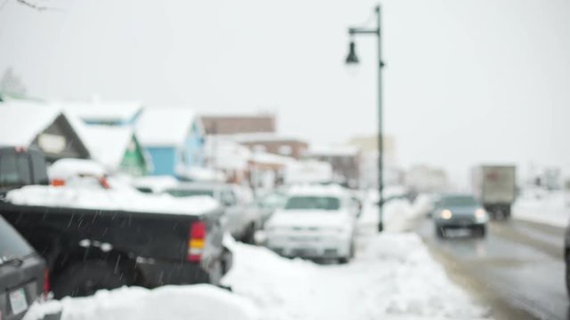 Snow covered cars in a suburban parking lot for background plate