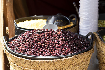 black spanish olives in a basket at street market