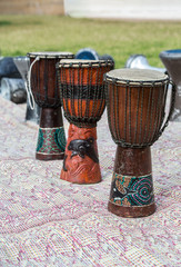 african drums on a carpet outdoors