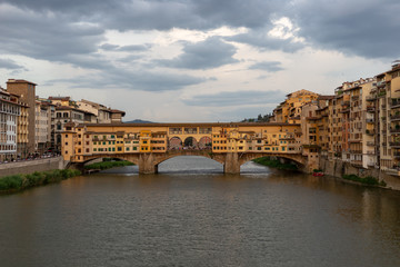Fototapeta na wymiar A view at sunset on the bridge in Florence.