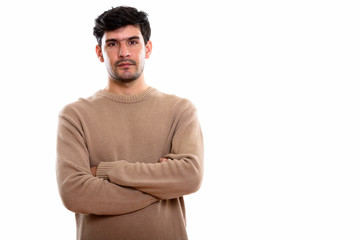 Obraz premium Studio shot of young Persian man with arms crossed