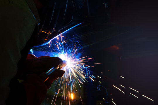 sparks during welding at the production process in semi-automatic welding of metal in argon protective gases