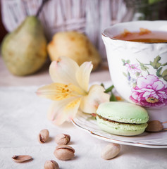 Pistachio macaroon and cup of tea