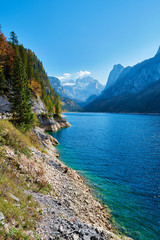 Colorful autumn landscape with mountains, lake and trees in Austrian Alps. Salzkammergut, Gosausee