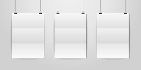 Three Vector Realistic White Blank Vertical A4 Folded Paper Poster Hanging on a Rope with Binder Clip Set on White Wall mock-up. Empty Poster Design Template for Graphics, Mockup