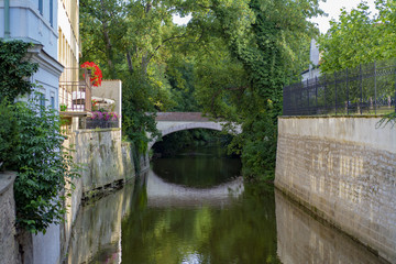 Naklejka premium A bridge across a small canal in an old European city