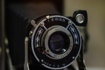 Fototapeta na wymiar Old film camera on a black background
