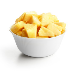 white bowl of sliced pineapple fruit isolated on whtie background