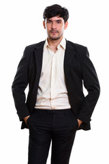 Fototapeta premium Studio shot of young Persian businessman standing with hands on 