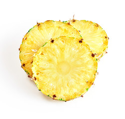 heap of pineapple slices isolated on whtie background