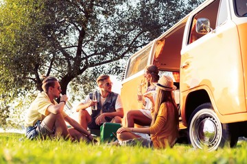 summer holidays, road trip, vacation, travel and people concept - smiling young hippie friends...