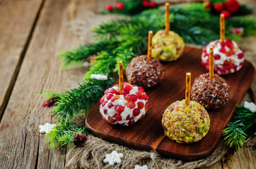Variation of goat cheese balls appetizer with pistachio, pomegranate and flax seeds - obrazy, fototapety, plakaty