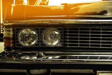 old classical car of white-blue color. macro front view. sunshine