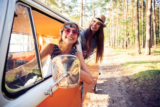 Hipster friends on road trip on a summers day