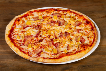 Pizza with bacon and pineapple