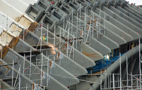 A Construction Worker welding on construction site.