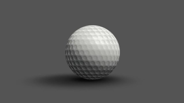 Golf ball rolls toward the camera and stops. Alpha channel.