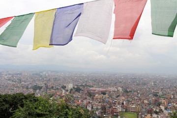 Translation: The prayer flags and wheels around Swayambhunath Stupa in Kathmandu