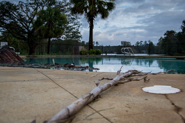 Pool with debris after hurricane Michael