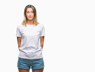 Fototapeta premium Young beautiful woman over isolated background with serious expression on face. Simple and natural looking at the camera.
