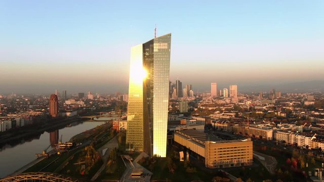 Frankfurt ECB Skyline Aerial Shot at early sunrise reflecting sun