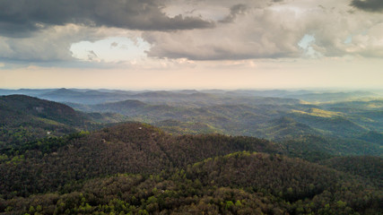Aerial of forested mountains and sky in North Carolina
