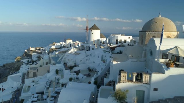Aerial view flying over city of Oia on Santorini Greece