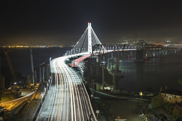 Bay Bridge in San Francisco light up with evening commuters