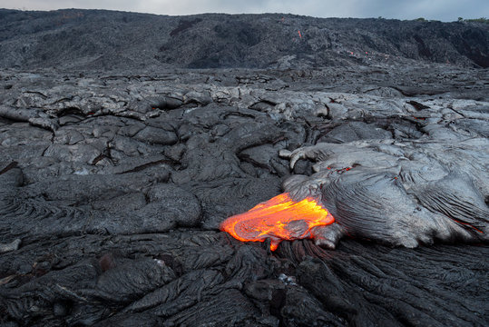 Lava flow from Puu Oo in Kalapana, Big Island, Hawaii. Pali in the background.