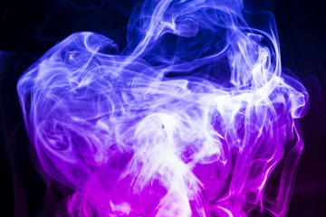 Fototapeta premium Colored smoke on black background