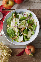 Apple and fennel salad with walnuts and greens