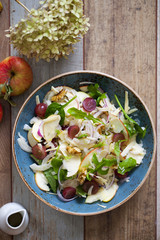 Apple and fennel salad with walnuts and greens