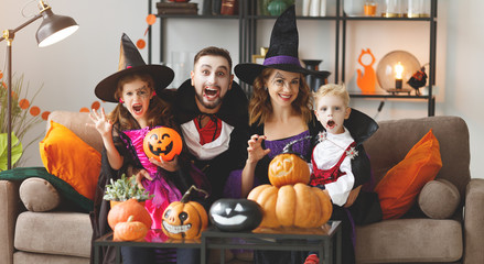 happy family mother father and children in costumes and makeup on  Halloween - obrazy, fototapety, plakaty
