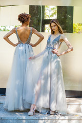 Fototapeta na wymiar Two fashion models in long gown