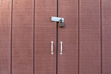 Brown wooden door with lock and handles