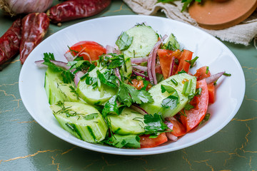 Vegetable salad with tomatoes and cucumbers