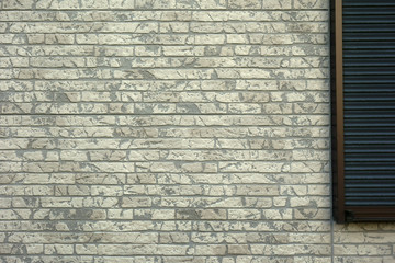 住宅のサイディング外壁とシャッター窓