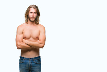 Young handsome shirtless man with long hair showing sexy body over isolated background skeptic and nervous, disapproving expression on face with crossed arms. Negative person.