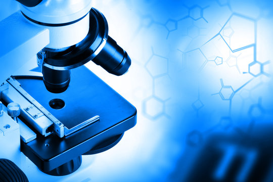 Research microscope with molecule structural formula - research or science concept