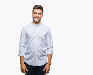 Fototapeta premium Young handsome man over isolated background looking away to side with smile on face, natural expression. Laughing confident.
