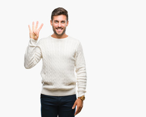 Naklejka premium Young handsome man wearing winter sweater over isolated background showing and pointing up with fingers number four while smiling confident and happy.