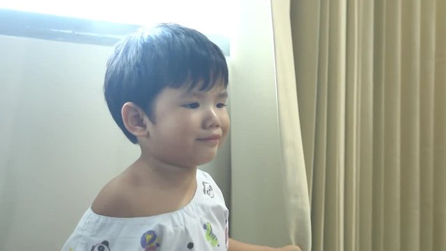 Thai child facial expression need to poop