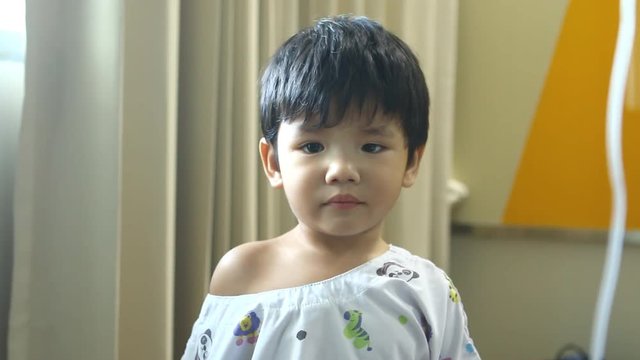 Thai child facial expression need to poop
