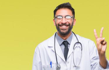 Adult hispanic doctor man over isolated background showing and pointing up with fingers number two while smiling confident and happy.