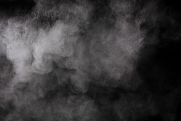 White powder isolated on black background.